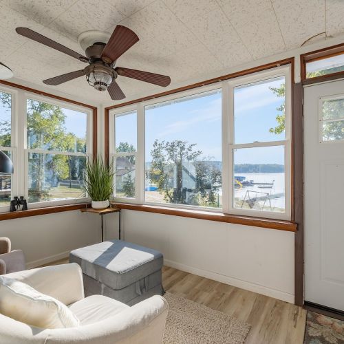 Porch with seating area overlooking the lake