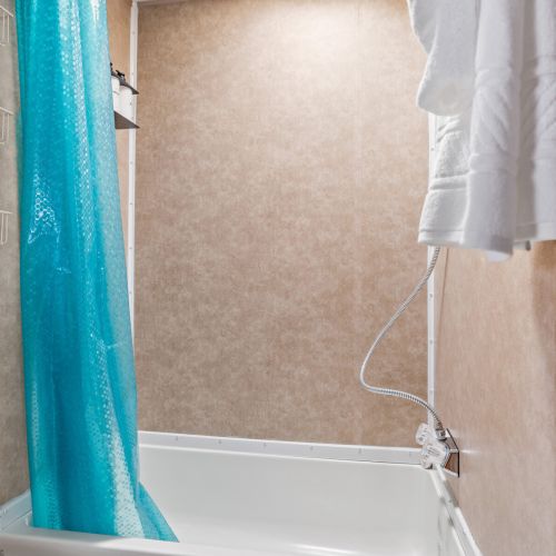 Toilet, Shower with tub, Shampoo, Conditioner, Body Wash, & Towels Provided