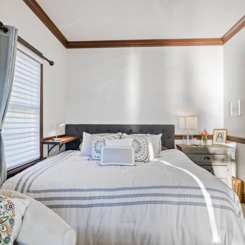 Large bedroom with king bed with lake views and jacuzzi