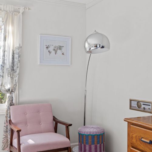 Chair and smart tv in the master bedroom.