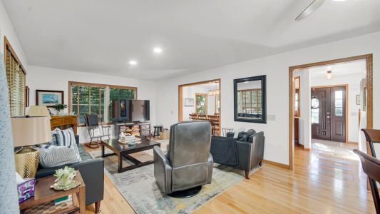 Cozy Living Room with Electric Fireplace, TV, and Family Games