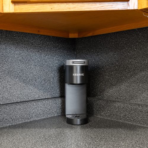 Enjoy your morning coffee with a convenient one-cup Keurig, perfect for a quick brew.