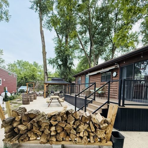 Funky Jungle - Wide-angle view of the property, highlighting the cabin and its charming outdoor surroundings. (Funky island is the red building on the left)