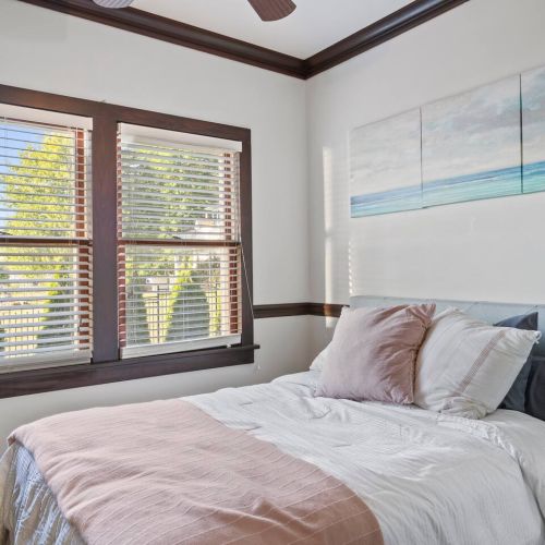 Bedroom with lake views and attached bathroom