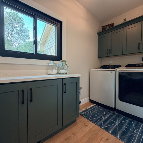 Convenient laundry area with washer and dryer for your extended stay.