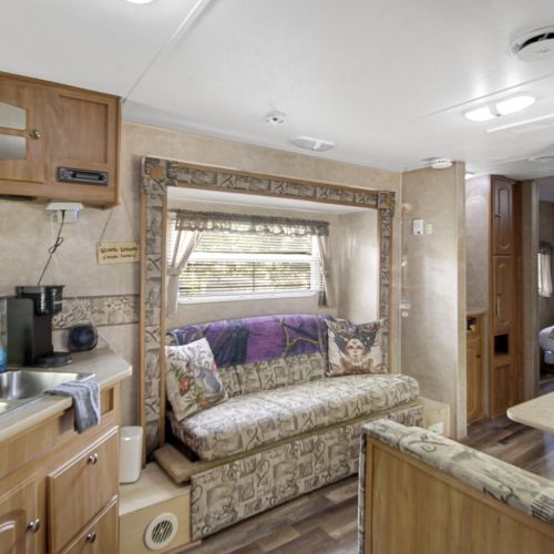 Comfortable seating in the living area, ideal for relaxing after a day at the campground.