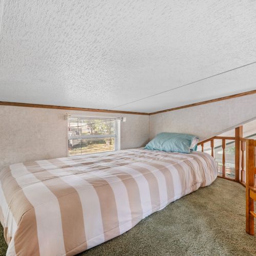 Another comfortable bed in the loft, perfect for extra guests or family stays.