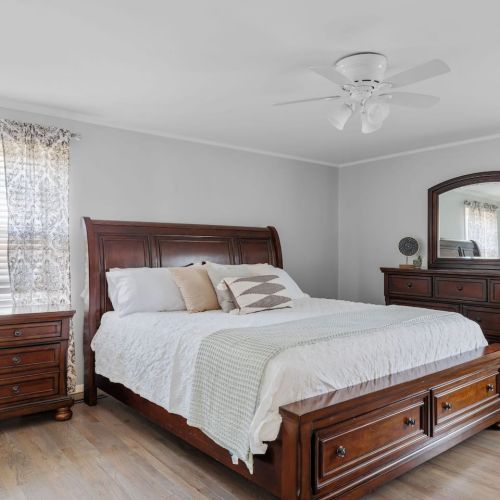 Main bedroom suit with king sized bed and 3/4 bathroom with shower