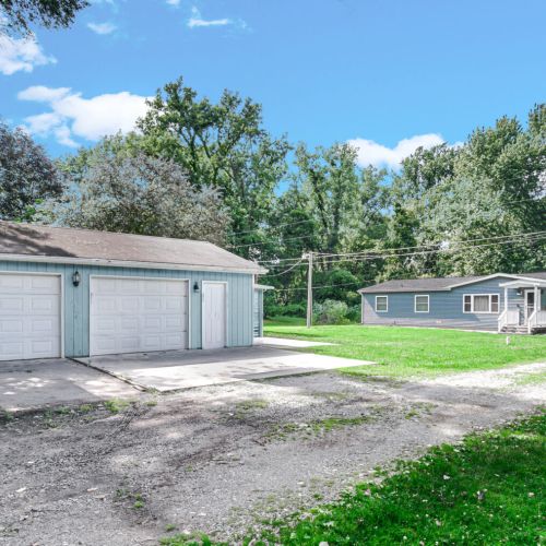 Spacious two-car detached garage and driveway located in front of the home.