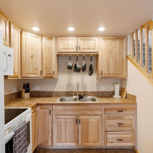 Kitchen stocked with pots/pans/dinnerware, basic spices, coffee maker and coffee.