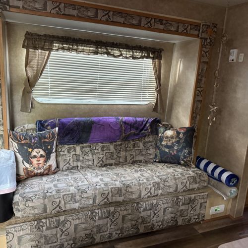 Comfortable seating in the living area, ideal for relaxing after a day at the campground.