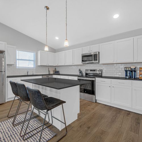 Kitchen island featuring convenient seating for family or guests