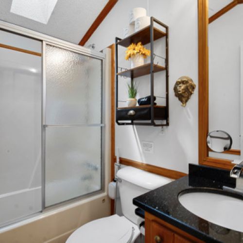 Clean and comfortable bathroom stocked with essentials.