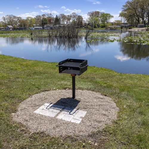 Outdoor grill overlooking lake