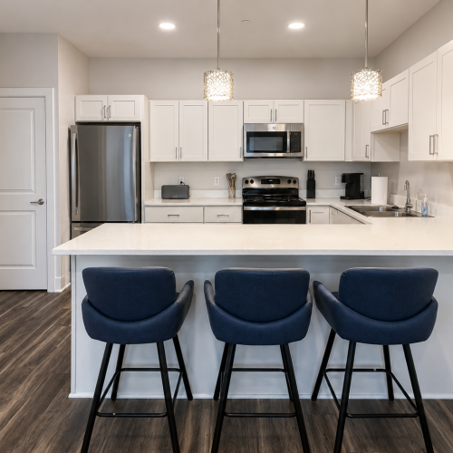 Kitchen with island and 3 stools
