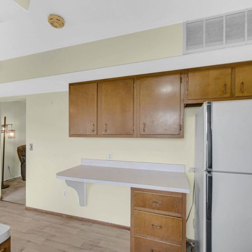 Kitchen view into the living room and an exterior door.