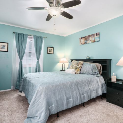 This Beautiful Primary Bedroom has a Queen size bed and a nice little vanity/desk.