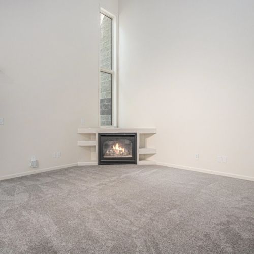 Enjoy the built in fireplace with a view of the outside.