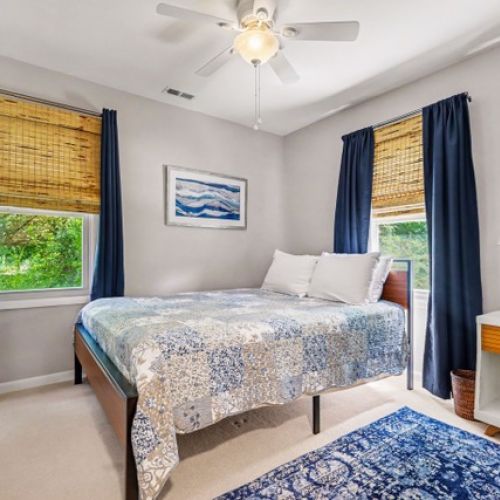 Bright and cozy queen bedroom.