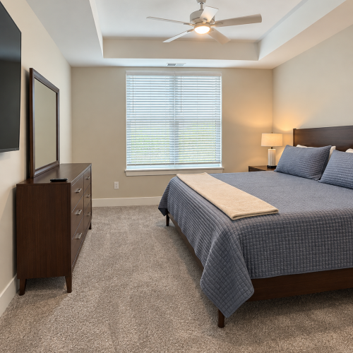 Bedroom with king bed and mirror