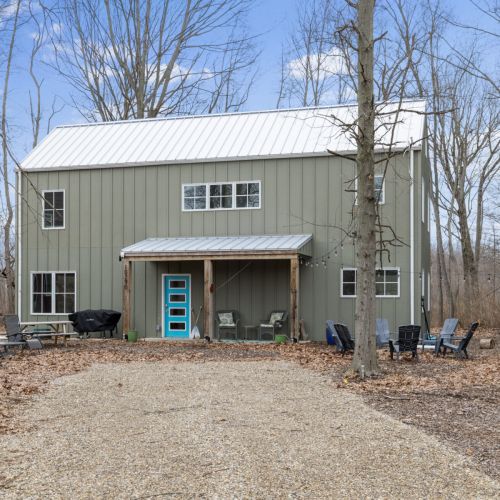 Front of the home with firepit area.