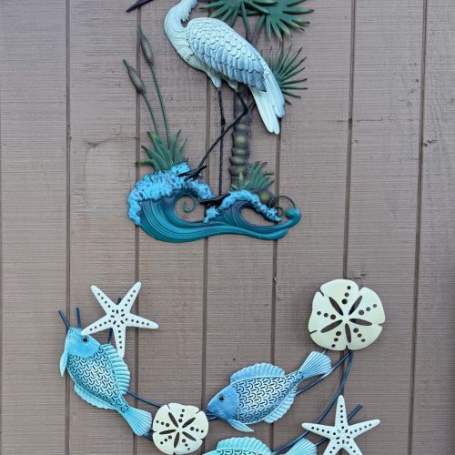 Decorative outdoor art with a beachy vibe, perfect for a relaxed, lakeside atmosphere.