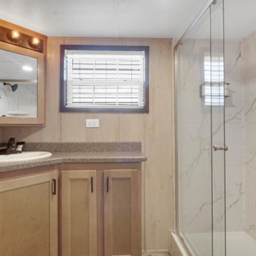 Modern bathroom featuring a walk-in shower.