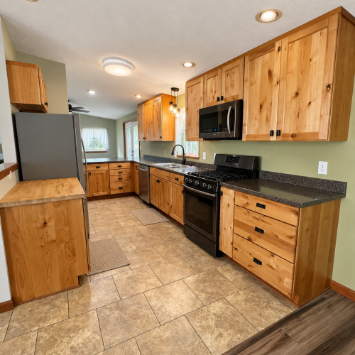 Bright, fully equipped kitchen with plenty of space for preparing meals.