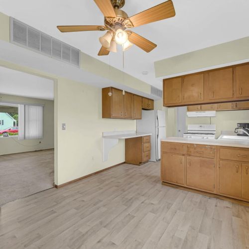 Kitchen and dining area looking into the living room.