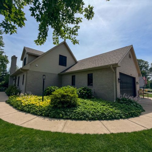 Attached garage and side exterior of the home.
