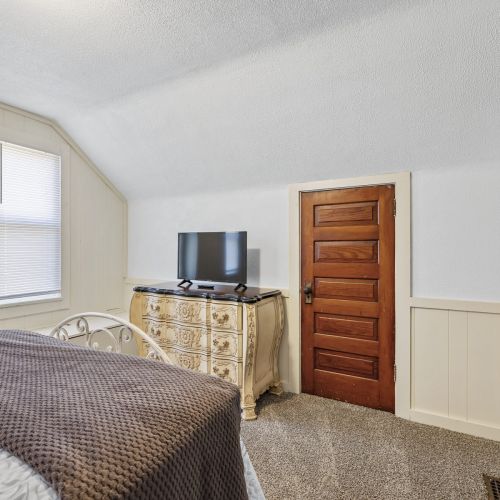 Bedroom 3 - View 2
Spacious bedroom designed for relaxation, featuring cozy accents and a homey feel.