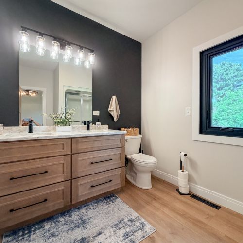Second full bathroom featuring a walk-in shower and modern finishes.