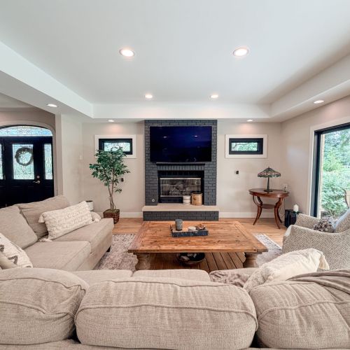 Make yourself at home in the inviting living room, featuring cozy seating and a welcoming atmosphere for everyday living.