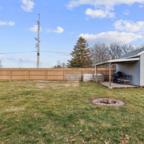 Back patio with seating for 4 and fire pit. Fenced in backyard