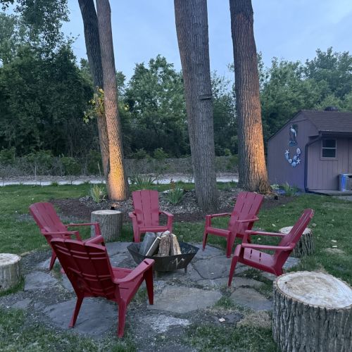 Fire pit, shed, and parking area for guests’ convenience.