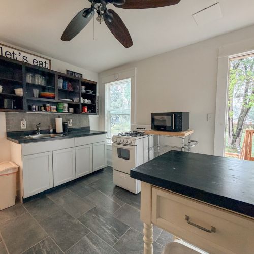 Second View of the kitchen space and entry door.