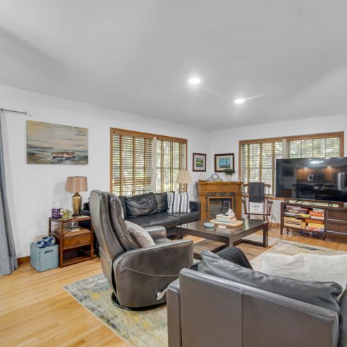 Cozy Living Room with Electric Fireplace, TV, and Family Games