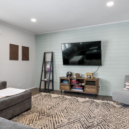 Sectional couch with tv, games, and a desk for working space. Beware of step down