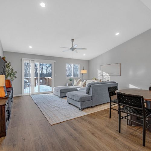 Spacious living area with sliding doors leading to the backyard deck.