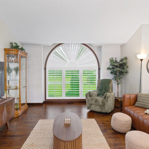 Bright living room with large picture window.